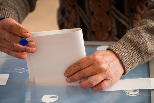 Person voting at polling station
