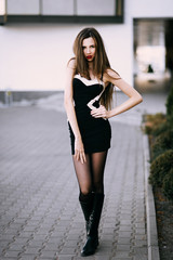 Obraz premium Autumn outdoor porttrait of young pretty elegant girl posing .