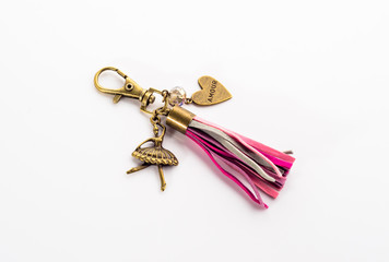 Fashionable key ring isolated on white, stylish boho jewelry