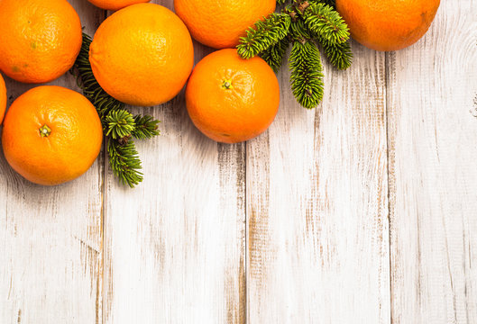 Fruit Of Oranges On Wooden Table And Decoration With Christmas Tree Branch