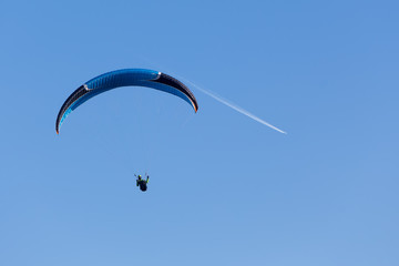 one paragliding in the sky