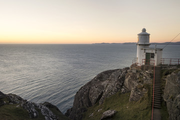 The lighthouse at sunset on the Sheeps Head Peninsula County Cork Ireland