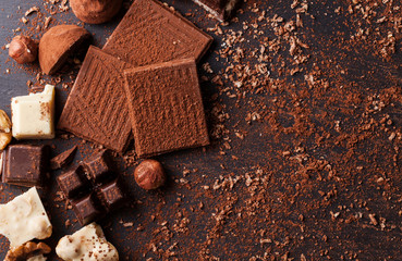 Variety of sweet homemade chocolate pralines on wooden background