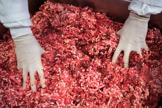 Pile of minced meat at meat factory