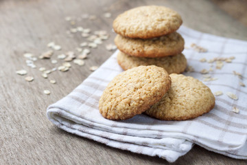 Homemade oatmeal cookies on checkered kitchen towel