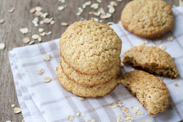 Homemade oatmeal cookies on checkered kitchen towel