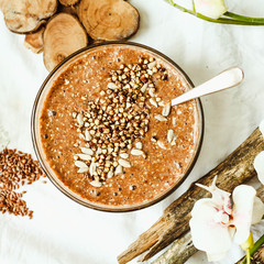 raw porridge from flax seeds with cocoa, banana and green buckwh