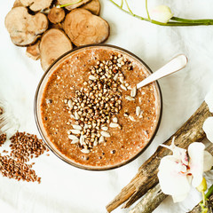 raw porridge from flax seeds with cocoa, banana and green buckwh