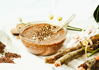 raw porridge from flax seeds with cocoa, banana and green buckwh