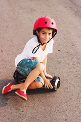 Boy with a gyro scooter, outdoors