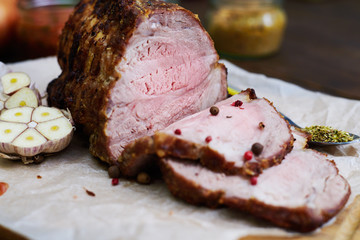 Extreme close-up of cut pieces of baked meat served on a cutting