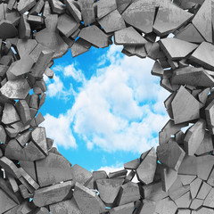 Cracked damage hole in concrete wall to cloudy sky