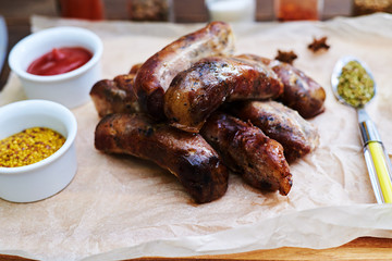 Overhead shot of a hip of grilled succulent sausages exposed on