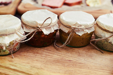 Portable lunchtime food in jars on the wooden table