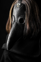 a masked man plague doctor