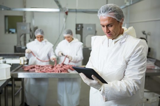 Technician using digital tablet