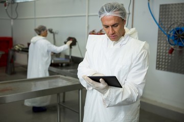 Technician using digital tablet
