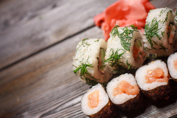 sushi, ginger, wooden background