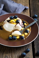 Panna cotta with fresh berries and caramel