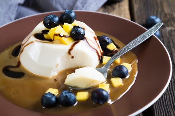 Panna cotta with fresh berries and caramel