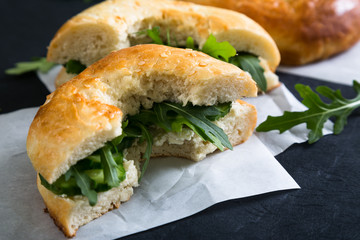 Bagels with cream cheese cucumber and arugula
