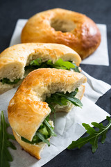 Bagels with cream cheese cucumber and arugula