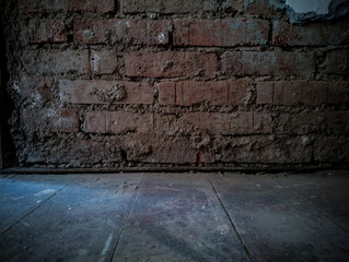 Dirty, scratched old brick wall, soft focus