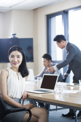 Confident businesswoman in meeting room
