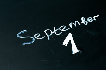 September 1 The phrase written in chalk on the blackboard.
