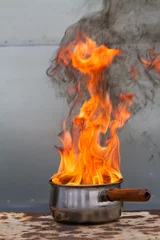  Vertical shot of saucepan on fire © Nicky Rhodes