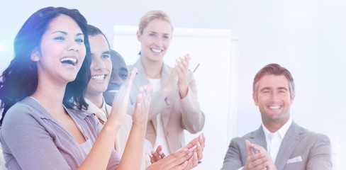 Fototapeta na wymiar Cheerful business people applauding in a meeting