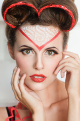 Portrait of fashion model in valentines look. Beautiful woman with original makeup and hair decoration, ready for theme party. Fun, costume, beauty, Valentine Day concept