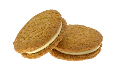Cheesecake filled pumpkin cookies on a white background.