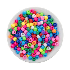 Small bowl filled with pony beads isolated on a white background.