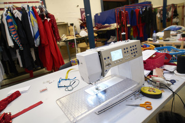 sewing table with lots of threads