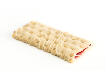 Isolated strawberry filled granola bar on a white background
