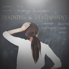 Attractive woman looking at a chalkboard
