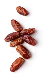 Fresh brown dates with seeds on a white background top view