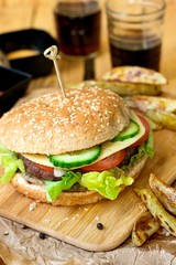 Beef hamburger with whole wheat bun and french fries