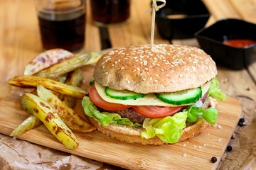 Beef hamburger with whole wheat bun and french fries