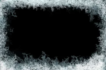 Fotobehang Frostwork. Decorative frostwork ice crystals frame on black background. Can be used as window frost overlay in design © PawelG Photo