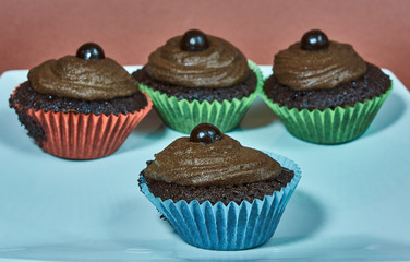 Dessert cookies muffins with cream and chocolate.