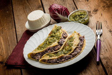 pesto crepes filled with ricotta and chicory