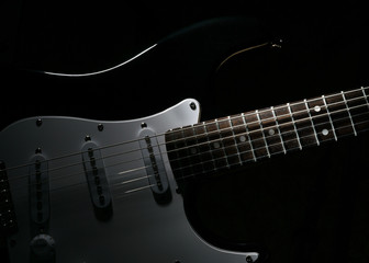 Fototapeta na wymiar Electric guitar in the dark