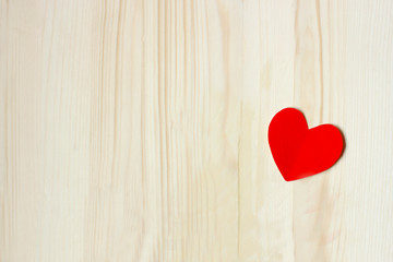 Heart on wooden surface.