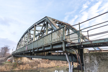 Fototapeta na wymiar Old rusty railroad bridge
