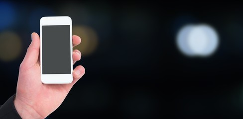 Composite image of hand of businessman holding smart phones 3d