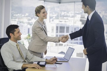 Business people shaking hands with their future patner