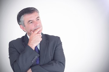 Businessman looking thoughtful