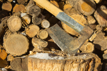 Axe chopping woods, pieces of woods ready for winter home cabin fire